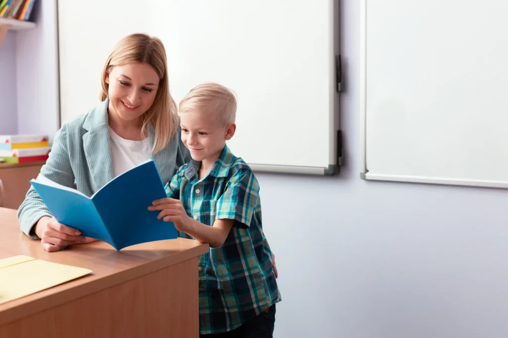 a woman reading with a young boy